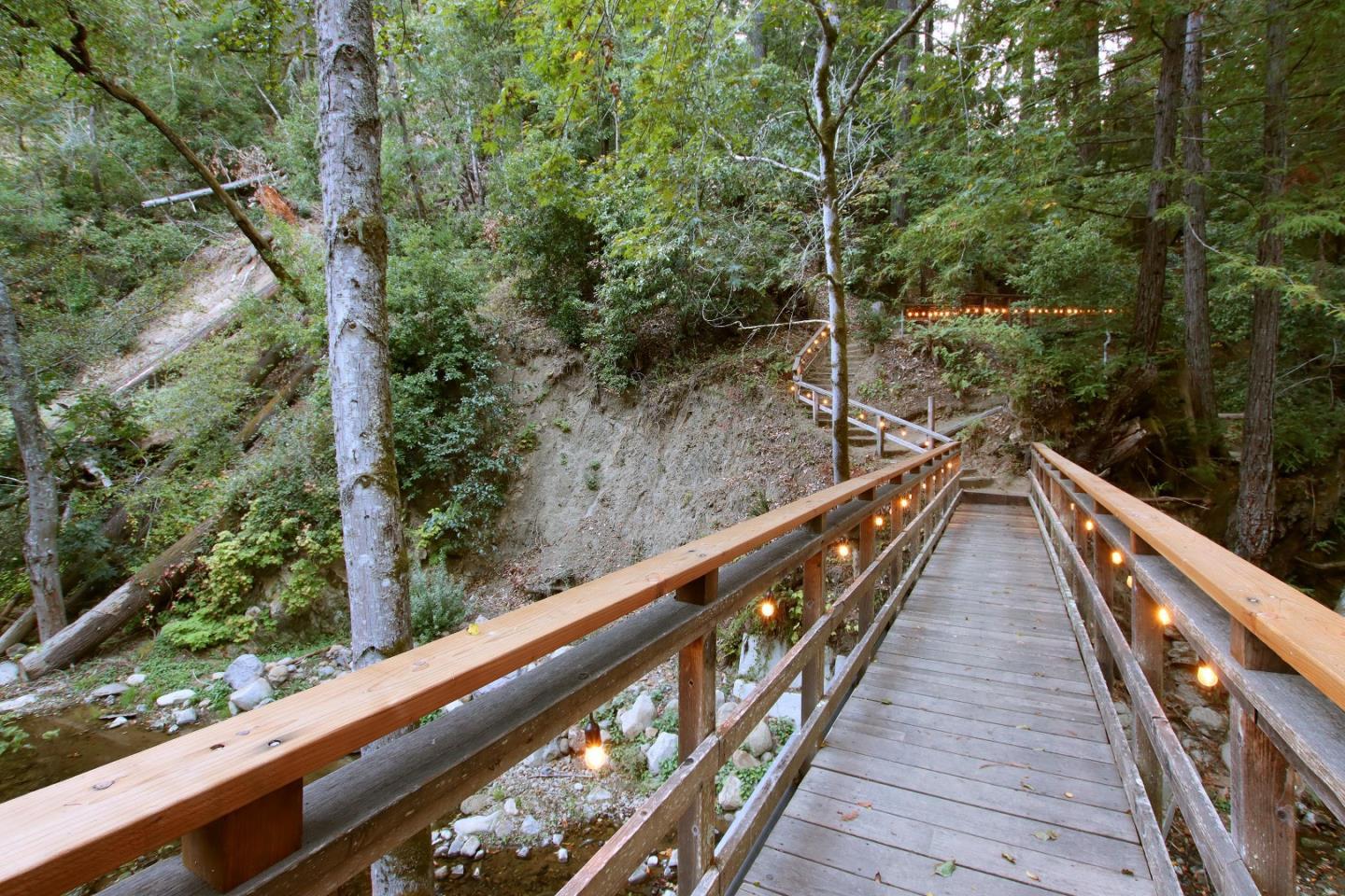 A wooden footbridge crossing the creek at Laurel Mill Lodge.